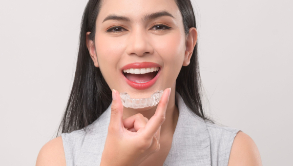 Lady comfortably shows off her Houston Invisalign.