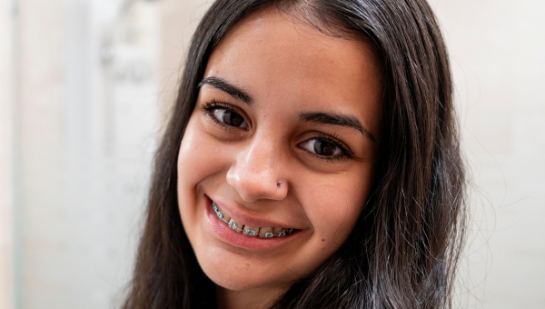 Experience this girl’s confidence with a Houston braces treatment.