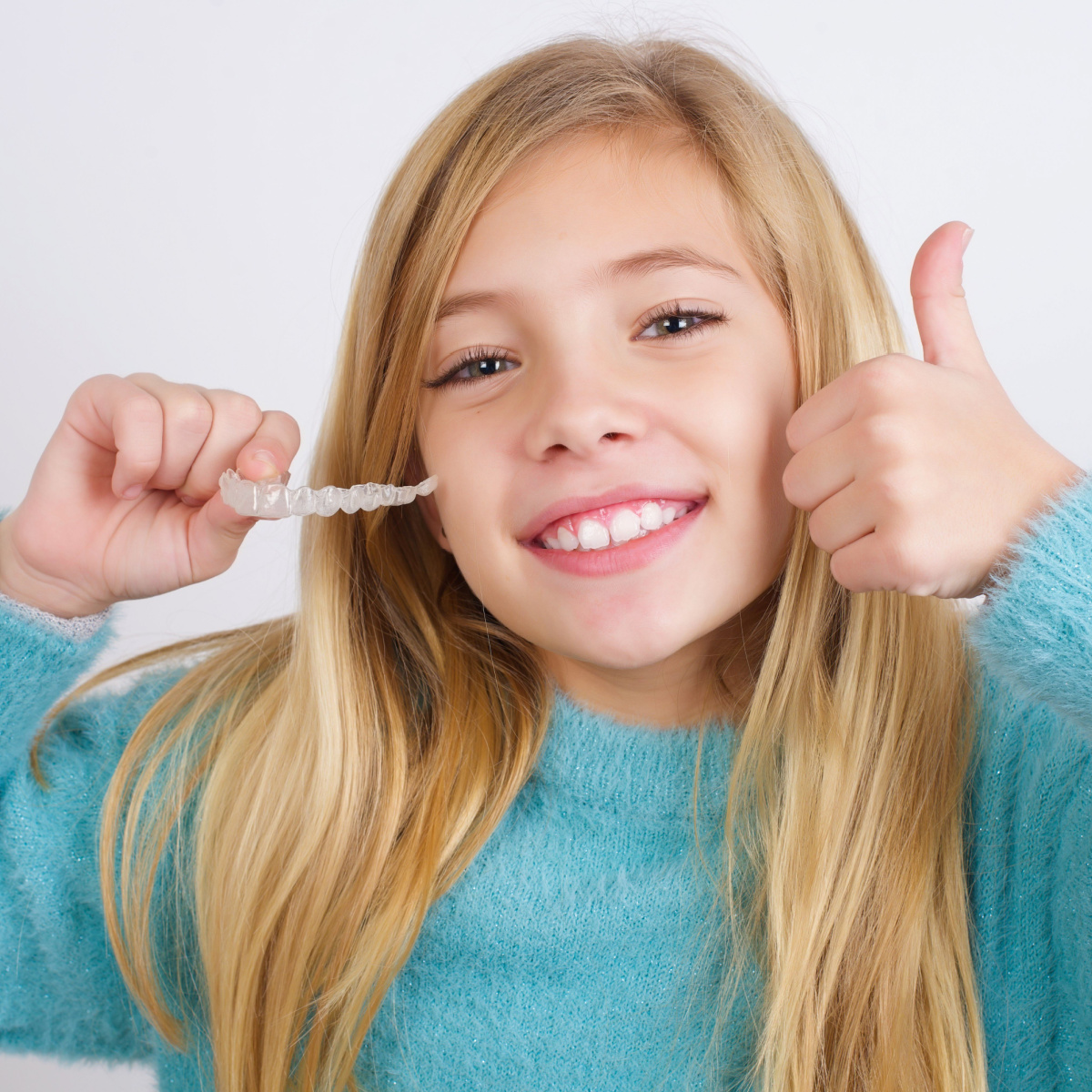 Young kid enjoys benefits of early South Houston braces treatment.