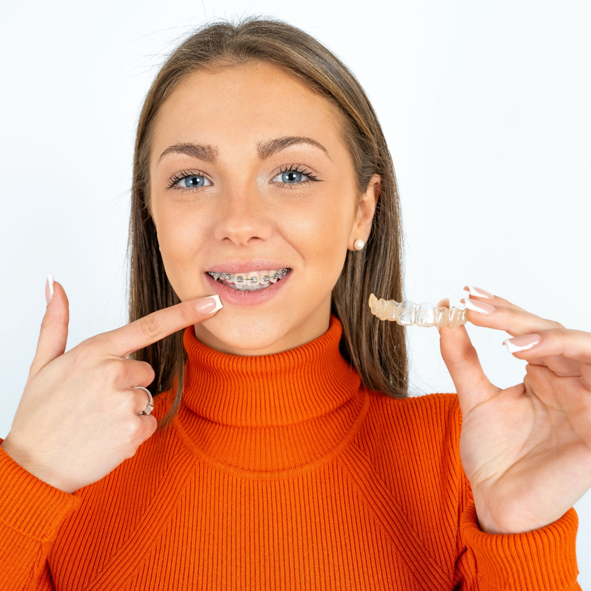 Woman deciding between Invisalign or Houston braces.