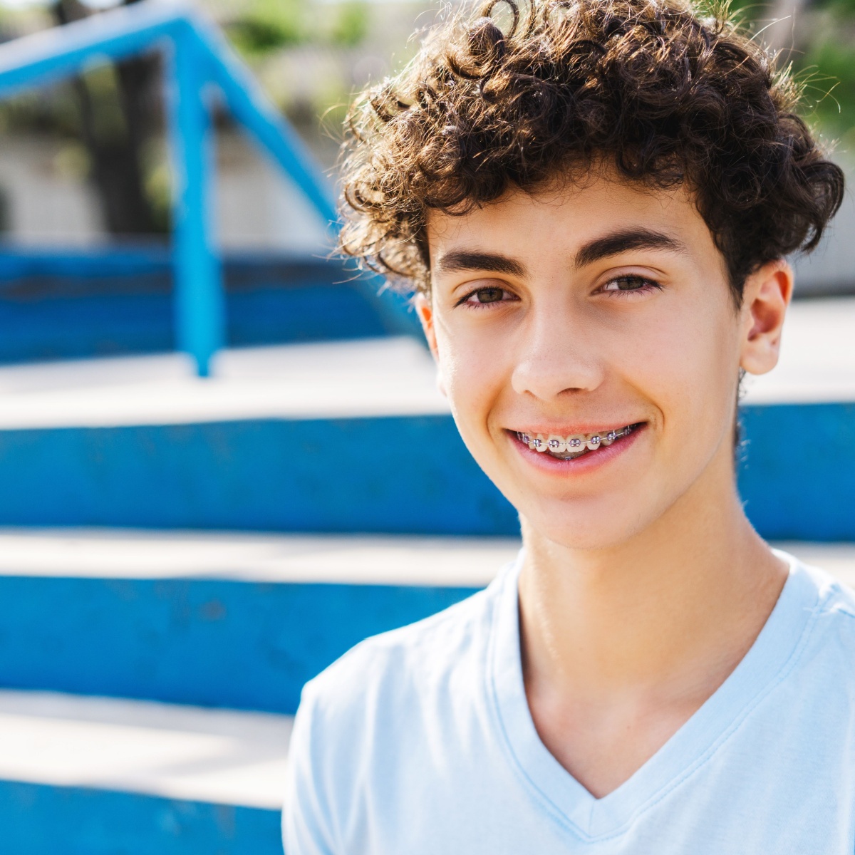 Young adult with Houston braces flashes a confident smile.