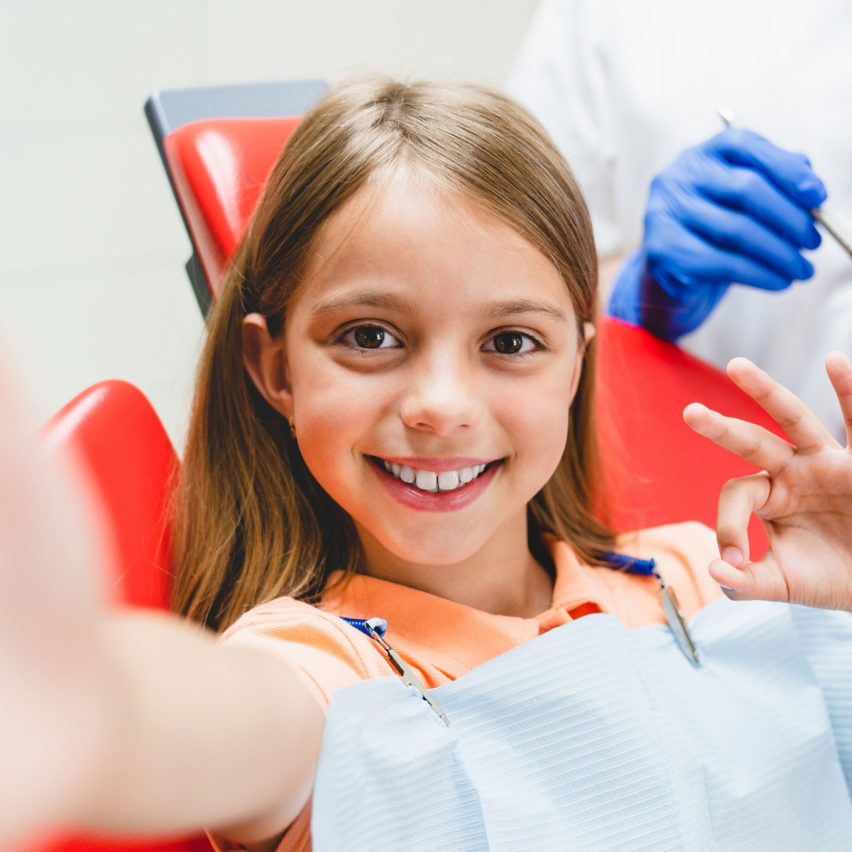 Girl in good health smiles after finishing Houston braces treatment.