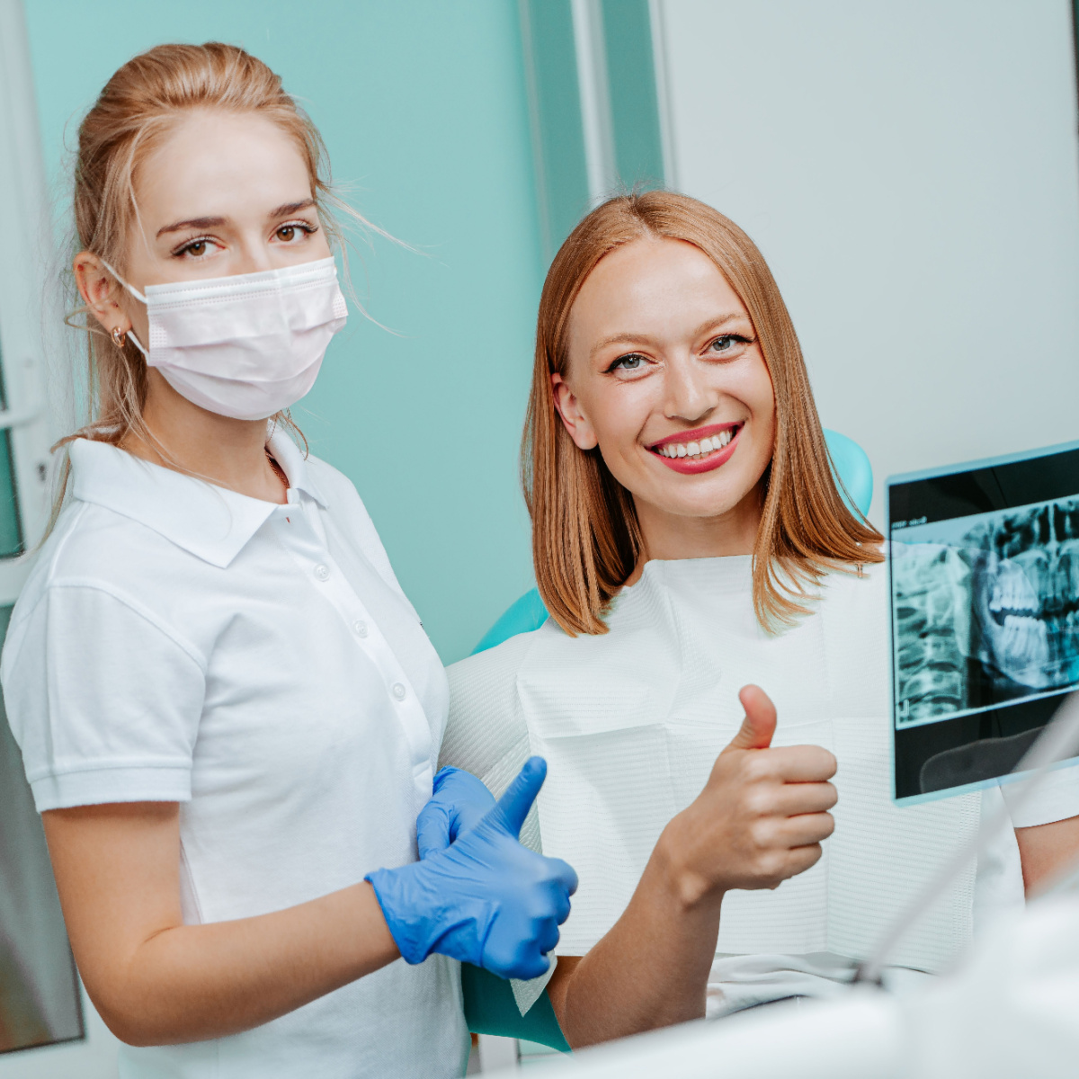 Houston dentist checks patient’s xray for dental issues.