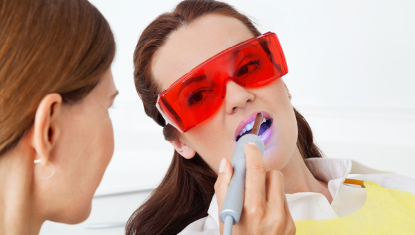 doctor using laser procedure on patient