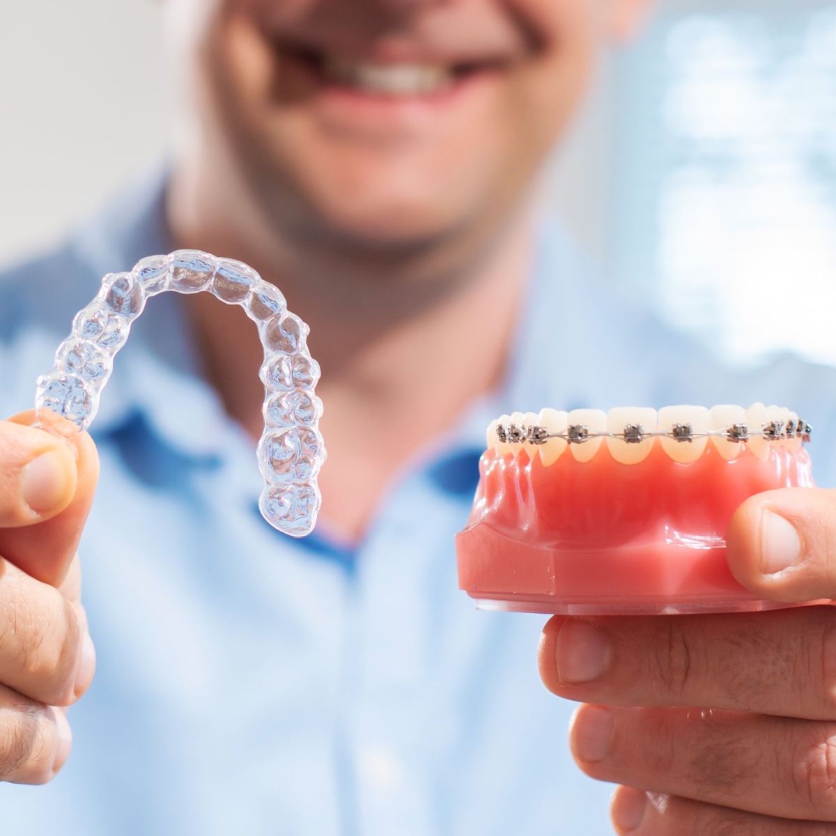 Choosing between metal braces and clear aligners