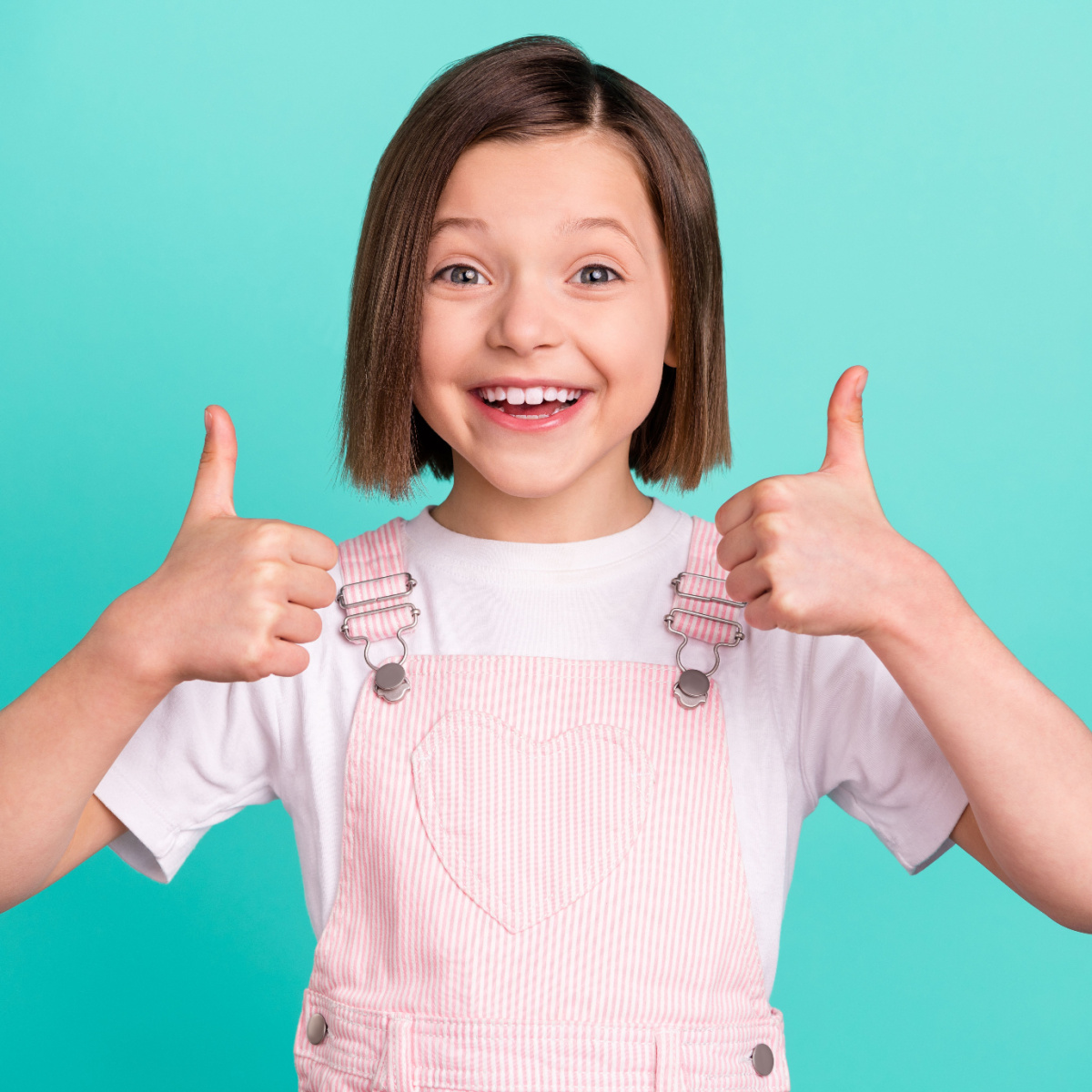 Happy girl with perfect cavity-free smile regularly visits her Houston dentist.